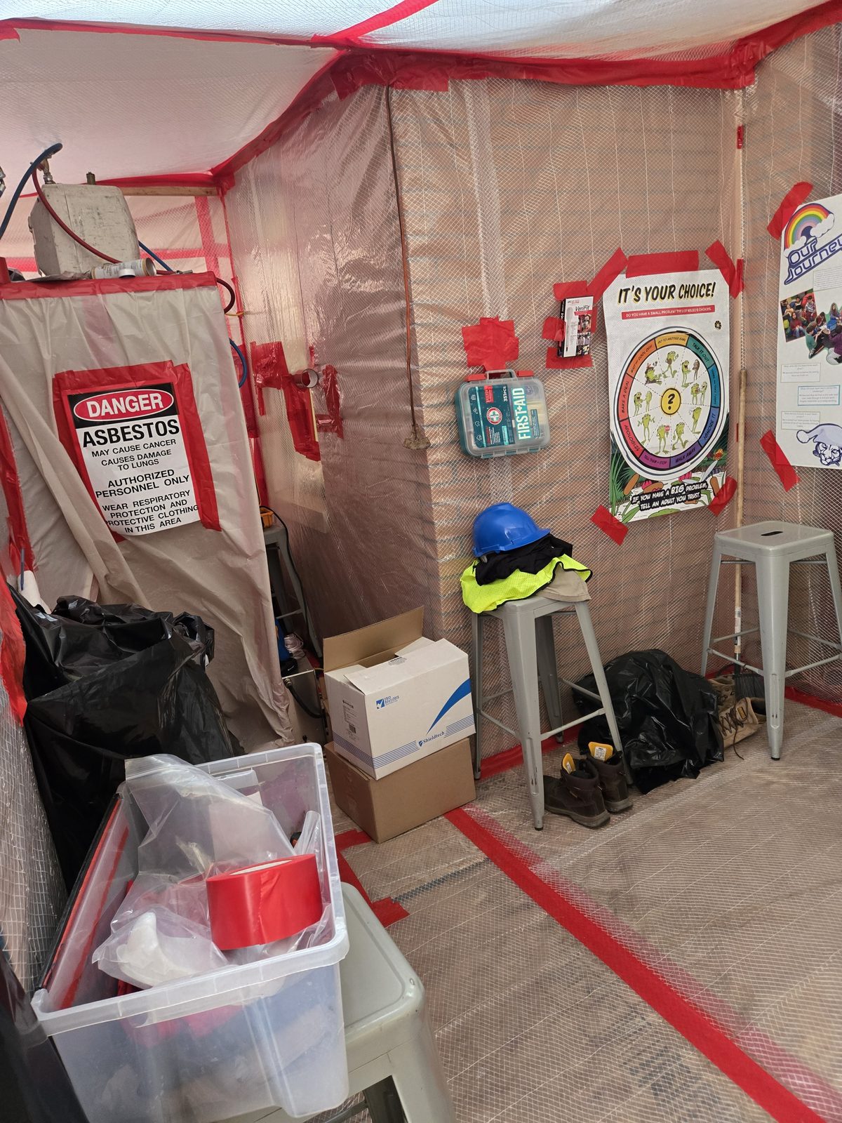 Asbestos hazard signage on a Remediation Pros jobsite