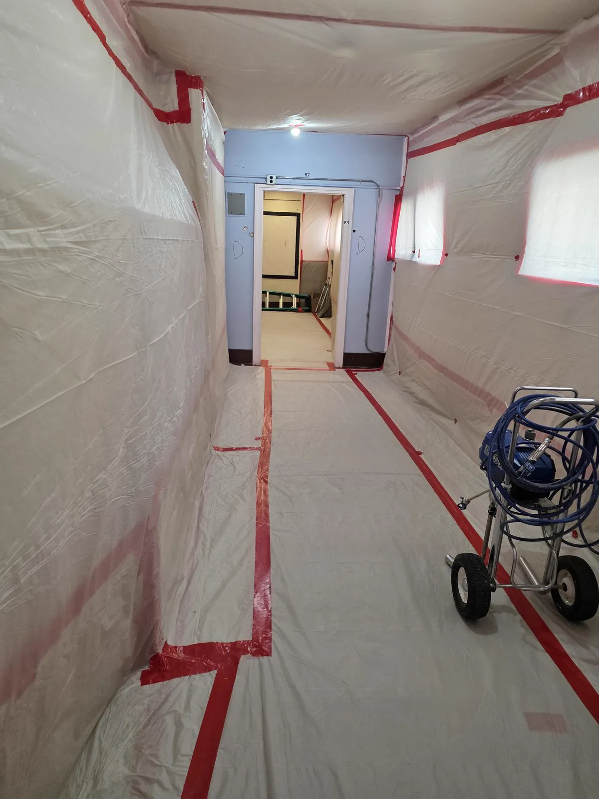 Negative-pressure containment with HEPA filtration in place
